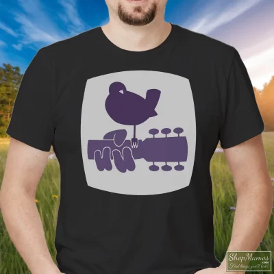 Men's 1969 Woodstock Crew Staff Grateful Dead Hendrix Who Joplin T Shirt In Black, Front View On Light Wood Background