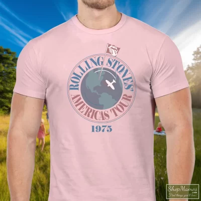 Men's 1975 Rolling Stones Concert Tour Rock T Shirt In Light Pink, Front View On Dark Wood Background