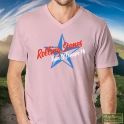 1976 Rolling Stones Tour Of Europe T Shirt 6 Men's 1976 Rolling Stones Tour Of Europe V Neck In Light Pink, Front View On Dark Wood Background