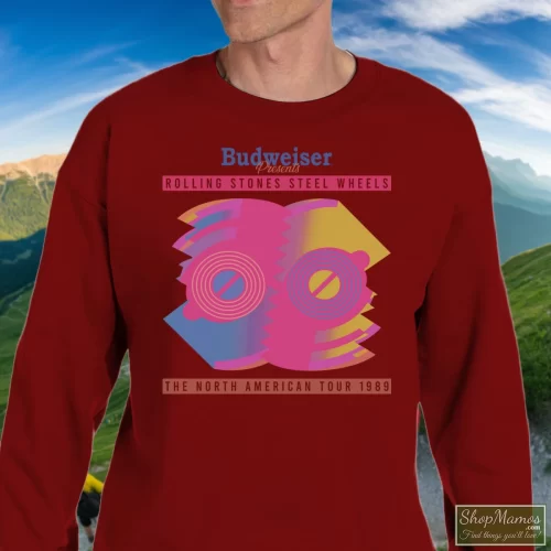 1989 Rolling Stones Steel Wheels Tour Men’s Sweatshirt – Maroon Front View On Light Wood Background Men's 1989 Rolling Stones Steel Wheels Tour Sweatshirt In Maroon, Front View On Light Wood Background