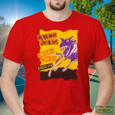Men's 1990 Europe Tour Rolling Stones Urban Jungle T Shirt In Red, Front View On Dark Wood Background
