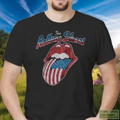 Men's 80s 1981 The Rolling Stones North American Rock Concert Tour T Shirt In Black, Front View On Light Wood Background
