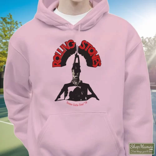80s The Rolling Stones 1978 Some Girls Tour Men’s Hoodie – Light Pink Front View On Dark Wood Background Men's 80s The Rolling Stones 1978 Some Girls Tour Hoodie In Light Pink, Front View On Dark Wood Background