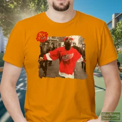 90s Tupac Shakur 2pac Wearing Detroit Red Wing Jersey Hip Hop Rap Hype Dope Swag Shirt 4 Men's 90s Tupac Shakur 2pac Wearing Detroit Red Wing Jersey Hip Hop Rap Hype Dope Swag T Shirt In Orange, Front View On Dark Wood Background