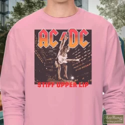 ACDC Band Tees 2000 ACDC Stiff Upper Lip Tour Tee Shirt 9 Men's Acdc Band Tees 2000 Acdc Stiff Upper Lip Tour Long Sleeve In Light Pink, Front View On Dark Wood Background