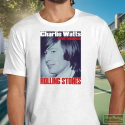 Charlie Watts Rolling Stones Drummer Shirt 3 Men's Charlie Watts Rolling Stones Drummer T Shirt In White, Front View On Dark Wood Background