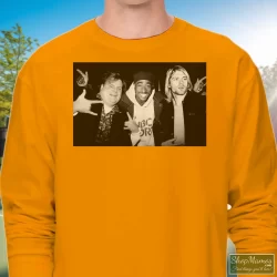 Chris Farley Tupac Shakur And Kurt Cobain Partying Shirt 90s Streetwear Hip Hop Er 2pac 8 Men's Chris Farley Tupac Shakur And Kurt Cobain Partying 90s Streetwear Hip Hop Er 2pac Long Sleeve In Orange, Front View On Dark Wood Background