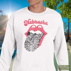 Leopard Tongue Rolling Stones Style Nebraska Huskers Shirt White 7 Men's Leopard Tongue Rolling Stones Style Nebraska Huskers White Sweatshirt In White, Front View On Dark Wood Background