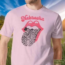 Leopard Tongue Rolling Stones Style Nebraska Huskers Shirt White 5 Men's Leopard Tongue Rolling Stones Style Nebraska Huskers White T Shirt In Light Pink, Front View On Dark Wood Background