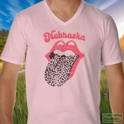 Leopard Tongue Rolling Stones Style Nebraska Huskers Shirt White 3 Men's Leopard Tongue Rolling Stones Style Nebraska Huskers White V Neck In Light Pink, Front View On Dark Wood Background