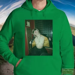 Miley Cyrus Rolling Stones Magazine Plastic Hearts Rock Shirt 2 Men's Miley Cyrus Rolling Stones Magazine Plastic Hearts Rock Hoodie In Irish Green, Front View On Light Wood Background