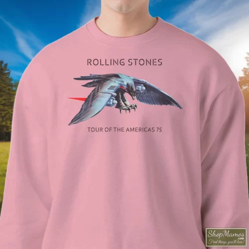 Original 1975 The Rolling Stones Concert Tour Rock Men’s Sweatshirt – Light Pink Front View On Dark Wood Background Men's Original 1975 The Rolling Stones Concert Tour Rock Sweatshirt In Light Pink, Front View On Dark Wood Background