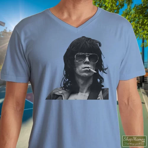 Rolling Stones Keith Richards Men’s V Neck – Light Blue Front View On Dark Wood Background Men's Rolling Stones Keith Richards V Neck In Light Blue, Front View On Dark Wood Background