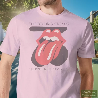 Men's Rolling Stones Sucking In The Seventies White T Shirt In Light Pink, Front View On Dark Wood Background