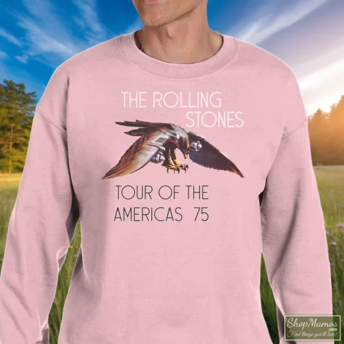 Rolling Stones Tour Of Americas 1975 Men’s Sweatshirt – Light Pink Front View On Dark Wood Background Men's Rolling Stones Tour Of Americas 1975 Sweatshirt In Light Pink, Front View On Dark Wood Background