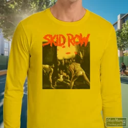 Skid Row 1991 Slave To The Grind Tour Shirt 3 Men's Skid Row 1991 Slave To The Grind Tour Long Sleeve In Yellow, Front View On Dark Wood Background