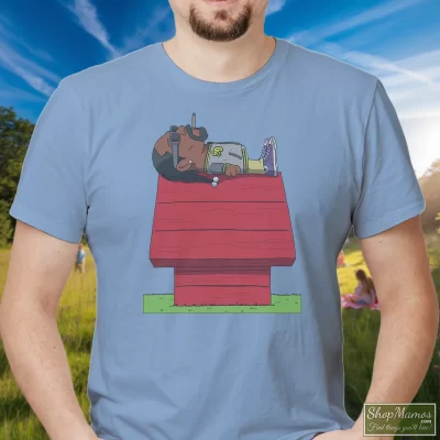Men's Snoop Dogg Snoopy T Shirt In Light Blue, Front View On Dark Wood Background