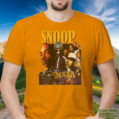 Men's Snoop Doggy Dogg T Shirt In Orange, Front View On Dark Wood Background