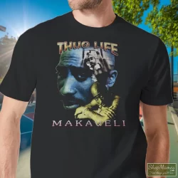 Tupac Shakur 2pac Thug Life One Year In Memory Memorial Shirt 11 Men's Tupac Shakur 2pac Thug Life One Year In Memory Memorial T Shirt In Black, Front View On Light Wood Background