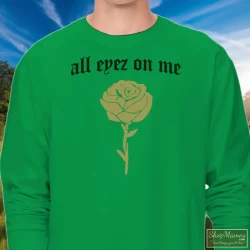 Tupac Shakur All Eyez On Me New Era Shirt 6 Men's Tupac Shakur All Eyez On Me New Era Long Sleeve In Irish Green, Front View On Light Wood Background