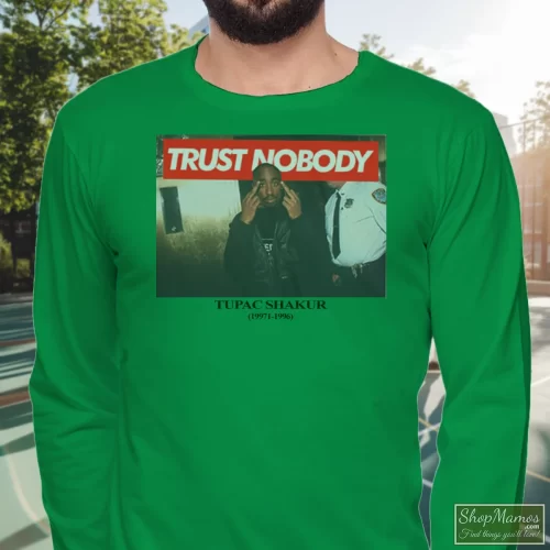 Tupac Shakur Trust Nobody Men’s Long Sleeve – Irish Green Front View On Light Wood Background Men's Tupac Shakur Trust Nobody Long Sleeve In Irish Green, Front View On Light Wood Background