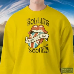 Vintage Rolling Stones Europe 82 Shirt 8 Men's Vintage Rolling Stones Europe 82 Sweatshirt In Yellow, Front View On Dark Wood Background