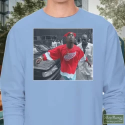 World Star Hiphop Tupac Shakur 2pac Detroit Spitting Hip Hop Rap Shirt 3 Men's World Star Hiphop Tupac Shakur 2pac Detroit Spitting Hip Hop Rap Long Sleeve In Light Blue, Front View On Dark Wood Background