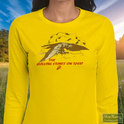 1975 Rolling Stones Concert Tour Rock Women’s Long Sleeve – Yellow Front View On Dark Wood Background Women's 1975 Rolling Stones Concert Tour Rock Long Sleeve In Yellow, Front View On Dark Wood Background