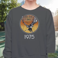 1975 Rolling Stones Tour Of The Americas Band Shirt 10 Women's 1975 Rolling Stones Tour Of The Americas Band Sweatshirt In Charcoal, Front View On Dark Wood Background