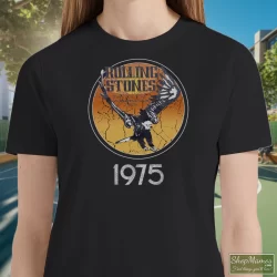 Women's 1975 Rolling Stones Tour Of The Americas Band T Shirt In Black, Front View On Light Wood Background