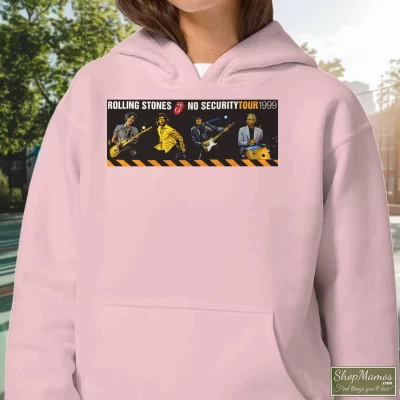 Women's 1999 Rolling Stones No Security Tour Hoodie In Light Pink, Front View On Dark Wood Background