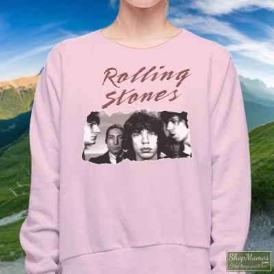 Women's 80s Rolling Stones Bad Boys Of Rock N Roll Sweatshirt In Light Pink, Front View On Dark Wood Background