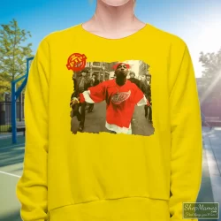 90s Tupac Shakur 2pac Wearing Detroit Red Wing Jersey Hip Hop Rap Hype Dope Swag Shirt 5 Women's 90s Tupac Shakur 2pac Wearing Detroit Red Wing Jersey Hip Hop Rap Hype Dope Swag Sweatshirt In Yellow, Front View On Dark Wood Background