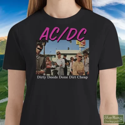 Women's Acdc Dirty Deeds Done Dirt Graphic T Shirt In Black, Front View On Light Wood Background