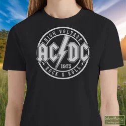 Women's Acdc High Voltage Rock & Roll 1975 Band Album Concert Tour T Shirt In Black, Front View On Light Wood Background