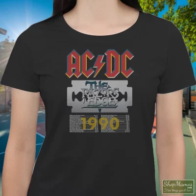 Women's Acdc The Razors Edge Tour 1990 T Shirt In Black, Front View On Light Wood Background