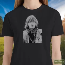 Women's Brian Jones Rolling Stones T Shirt In Black, Front View On Light Wood Background