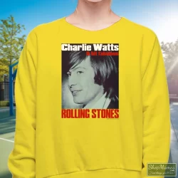 Charlie Watts Rolling Stones Drummer Shirt 7 Women's Charlie Watts Rolling Stones Drummer Sweatshirt In Yellow, Front View On Dark Wood Background