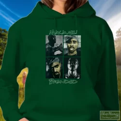 Distressed 2pac Tupac Shakur American Rapper Shirt 9 Women's Distressed 2pac Tupac Shakur American Rapper Hoodie In Forest Green, Front View On Light Wood Background
