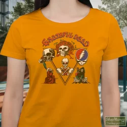 Women's Grateful Dead Jerry Garcia 1978 Tour T Shirt In Orange, Front View On Dark Wood Background