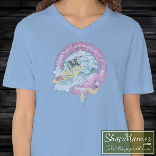 Women's Grateful Dead Surfing Skeleton Vintage Rock Graphic Style V Neck In Light Blue, Front View On Dark Wood Background