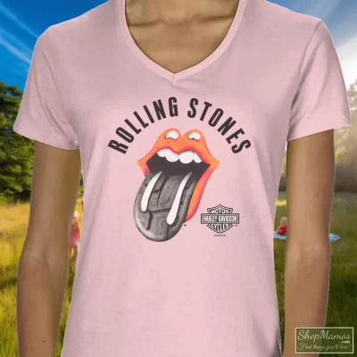 Women's Harley Davidson Rolling Stones Tire Tread White V Neck In Light Pink, Front View On Dark Wood Background