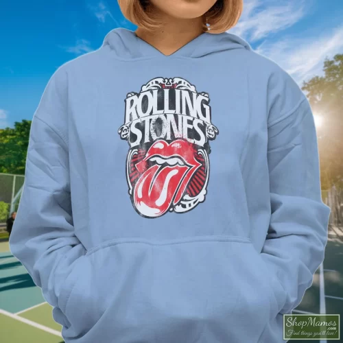 The Rolling Stones 1978 Tongue Womans Long Sleeve Women’s Hoodie – Light Blue Front View On Dark Wood Background Women's The Rolling Stones 1978 Tongue Womans Long Sleeve Hoodie In Light Blue, Front View On Dark Wood Background