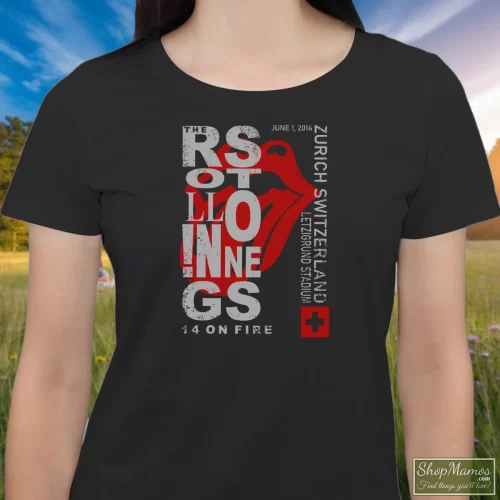 The Rolling Stones Concert Zurich Switzerland Women’s T Shirt – Black Front View On Light Wood Background Women's The Rolling Stones Concert Zurich Switzerland T Shirt In Black, Front View On Light Wood Background