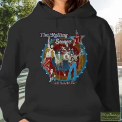 Thrashed Original 1981 The Rolling Stones Tatoo You Tour Shirt 9 Women's Thrashed Original 1981 The Rolling Stones Tatoo You Tour Hoodie In Black, Front View On Light Wood Background