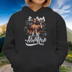 I Am Hip Hop Legends Rappers Signatures Shirt Tupac Shakur Nipsey Hussle Ice Cube Notorious Big Jay-z Eminem Snoop Dogg 8 Women's I Am Hip Hop Legends Rappers Signatures Tupac Shakur Nipsey Hussle Ice Cube Notorious Big Jay - Z Eminem Snoop Dogg Hoodie In Black, Front View On Light Wood Background