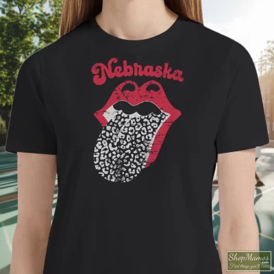 Women's Leopard Tongue Rolling Stones Style Nebraska Huskers Black T Shirt In Black, Front View On Light Wood Background