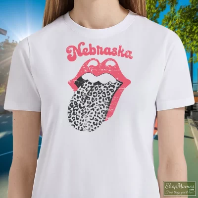 Women's Leopard Tongue Rolling Stones Style Nebraska Huskers White T Shirt In White, Front View On Dark Wood Background