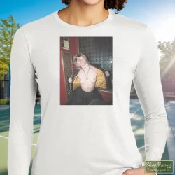 Miley Cyrus Rolling Stones Magazine Plastic Hearts Rock Shirt 3 Women's Miley Cyrus Rolling Stones Magazine Plastic Hearts Rock Long Sleeve In White, Front View On Dark Wood Background