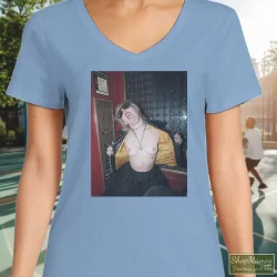Miley Cyrus Rolling Stones Magazine Plastic Hearts Rock Shirt 4 Women's Miley Cyrus Rolling Stones Magazine Plastic Hearts Rock V Neck In Light Blue, Front View On Dark Wood Background